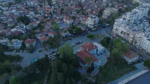 High Angle View of City Theatre Building Surrounded By Park Tilt Up Reveal Buildings in Old Town