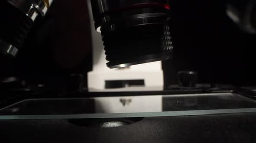 Microscope Objective Lens Focusing on Glass Slide Scientific Research