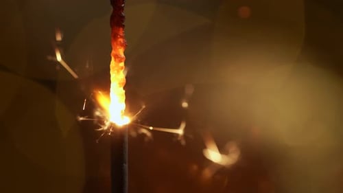 Burning Sparkler Celebrates Holidays and Festive Occasions