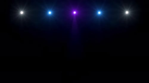 Lens flares spotlight on stage.