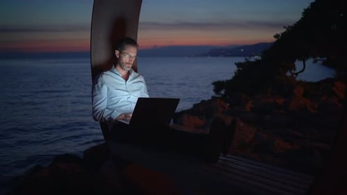 Working Remotely While Enjoying the Beautiful Seaside at Dusk with a Scenic View