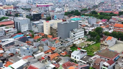 urban residential and commercial buildings densely packed in Jakarta Indonesia, aerial
