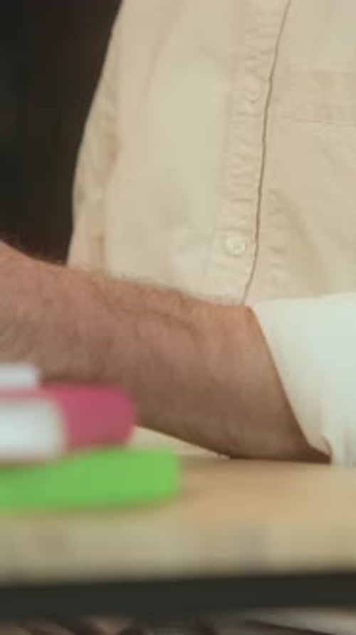 Close Up Hands Man Using Desktop Computer and Hold Paper Typing on Keyboard in Office Work Time