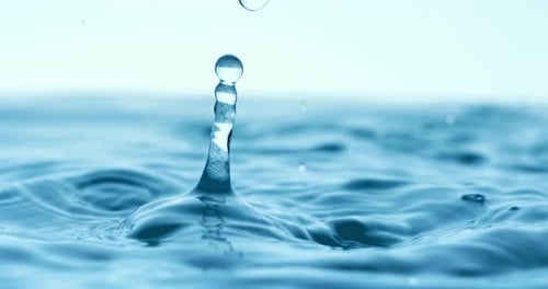 Rain water drops falling in super slow motion.