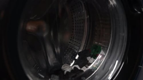 Laundry Spinning Inside Washing Machine Close Up