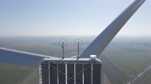 Aerial View of Wind Turbine in Countryside Area Renewable Energy Concept