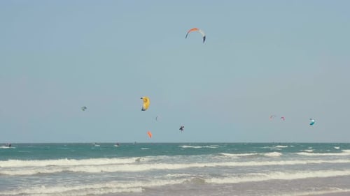 Kite Surfing or Windsurfing on Blue Sea Water