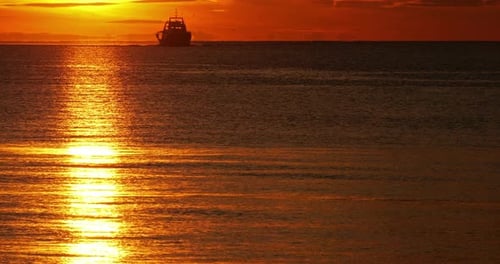 Fishing boats coming back to the harbour at sunset, France