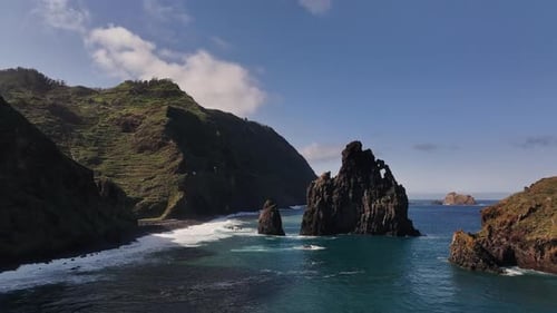 Vibrant Turquoise Waters Surround Towering Cliff Formations