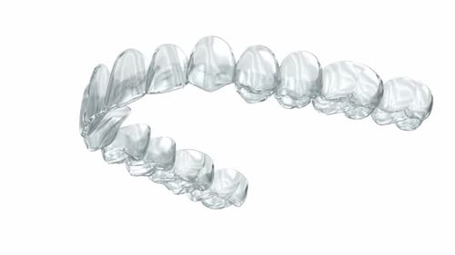 3D Animation of Clear Orthodontic Aligners Rotating on White Background