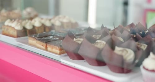 Bakery, donuts and display of cake in cafe to select snack, dessert and pastry for small business