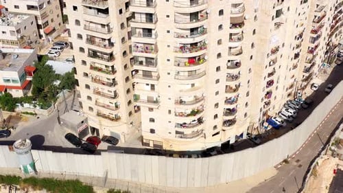 Security wall with Israeli idf watch tower Close to Shuafat Refugee Camp- Aerial