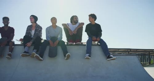 Friends, talking and men with skateboard on ramp for exercise, practice and hobby activity in city