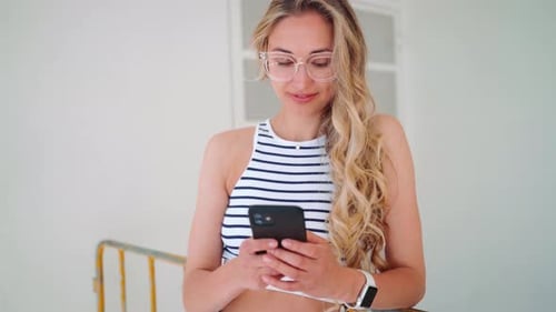 Caucasian Woman Wearing Glasses Using Smartphone