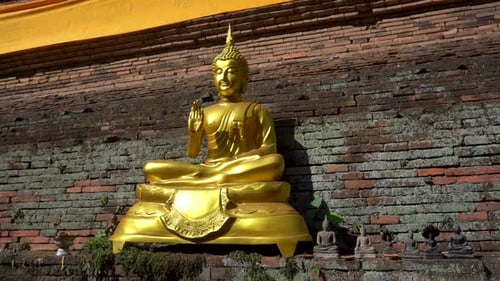 Worship Buddha statue at a Buddhist Temple in Chiang Mai, Thailand.
