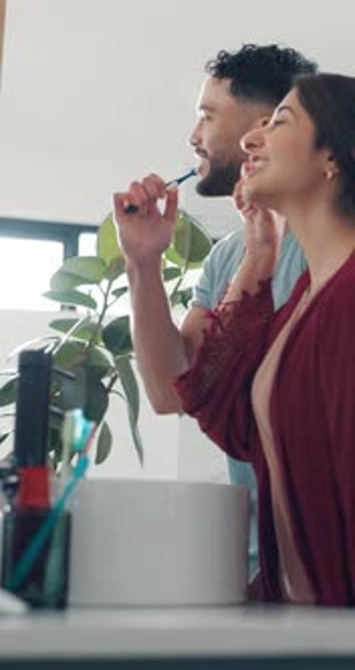 Home, brushing teeth and couple in bathroom, wellness and dental hygiene with morning routine