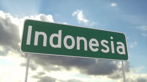 Welcome to Indonesia road sign on blue sky with clouds