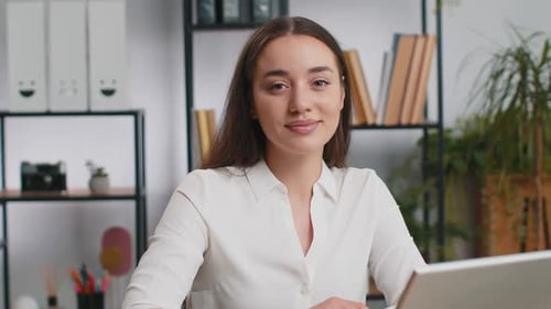 Portrait of Happy Smiling Brunette Caucasian Business Woman at Office Look Away Turn Head at Camera
