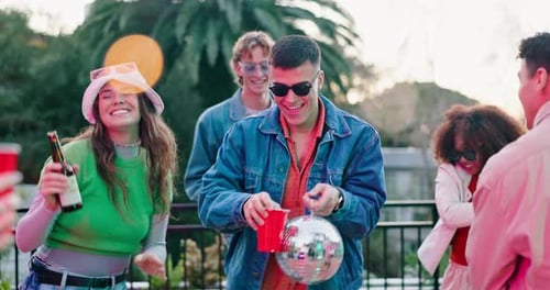 Friends Celebrating and Smiling Outdoors at Party