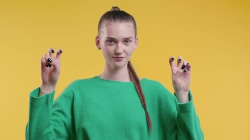 Young Woman Making Peace Sign Hand Gesture