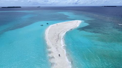 An island surrounded by coral reefs in the Maldives