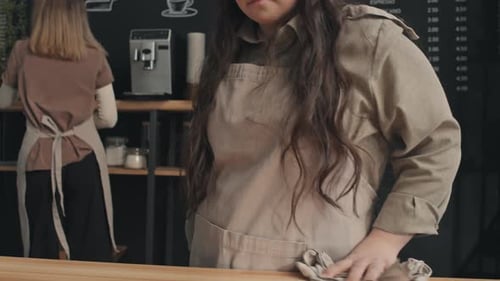 Women Working in a Clean and Modern Coffee Shop