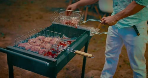 BBQ Party in Backyard of Summer House Mixed Race Man Cooking Meat on Grill for Friends Prores