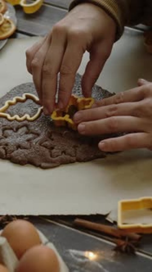 Cutting Gingerbread Dough with Cookie Cutters at Home