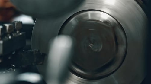 Precision metal lathe in action spinning part for machining process