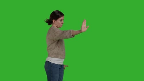 Side View of Young Woman Raising Palm As Rejection Gesture