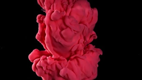 Peinture rouge dans l'eau sur fond noir filmée par une caméra haute vitesse à 1000 images par seconde