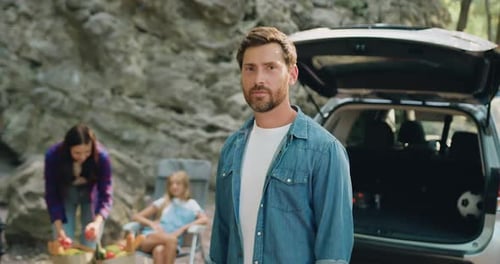 Family Relaxing Together at Scenic Outdoor Picnic