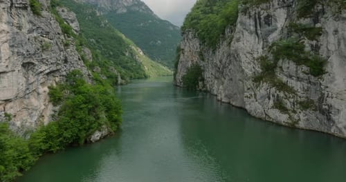 Aerial view of the beautiful drina river flowing through a deep canyon in the mountains. This
