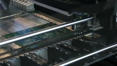 Automated Machine Processing Circuit Board in Electronics Factory