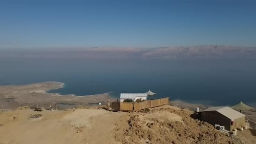 Aerial View of Desert Landscape and Turquoise Lake