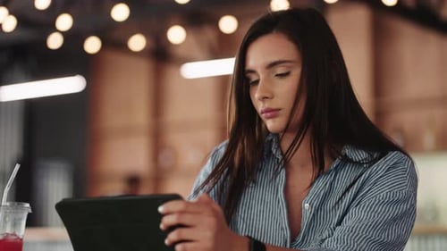Portrait Of Young Adult Woman Using Modern Tablet In Cafe Female User Of Internet And Social Media
