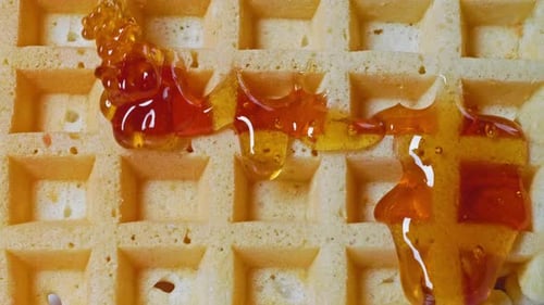 Delicious Syrup Topping a Fresh Waffle