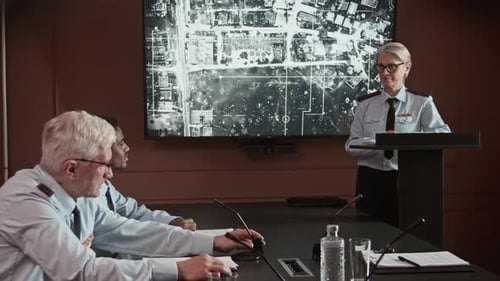 Colleagues Listening to Presentation in a Conference Room