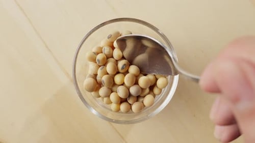 Slow motion shot of soybeans gracefully falling