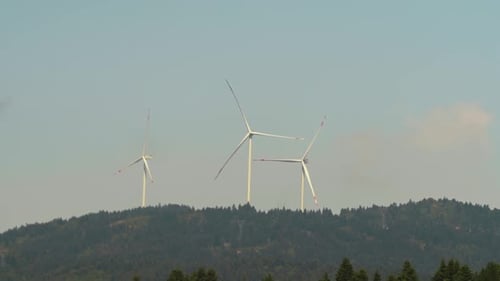 Wind Turbines on Green Hill Generating Clean Energy