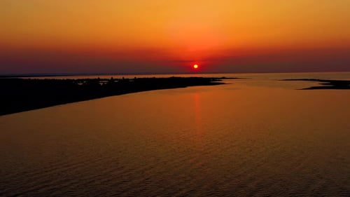 Drone aerial view Sunset Sun Over Sea.Orange Color Sunrise On Beach.Sunset On Sea Dramatic sea