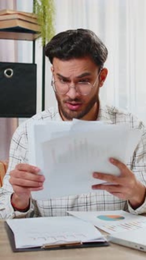 Frustrated Upset Angry Businessman Works with Paperwork Reports Documents Throwing Documents in Air