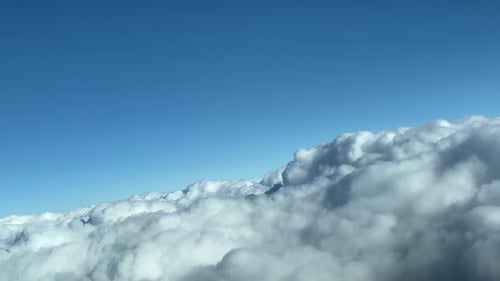 Aerial View of Cumulus Clouds Against Blue Sky