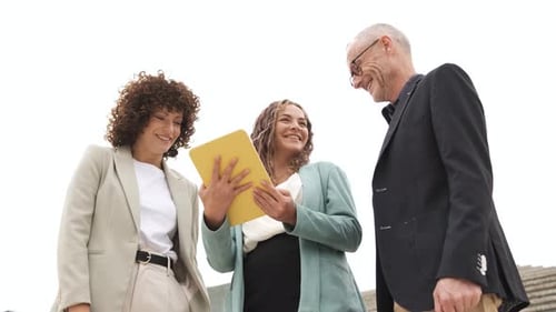 Business Team Looking at Tablet Together
