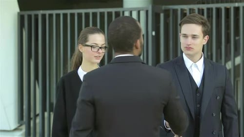 Business People Talking Outside Office Building