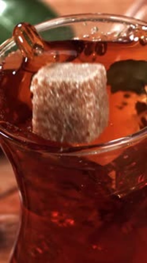 A Sugar Cube Falls Into Turkish Tea Filmed on a Highspeed Camera at 1000 Fps