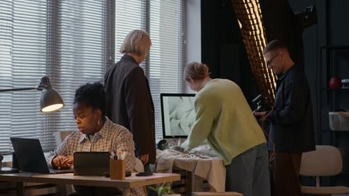 Team Collaborate in Studio at Desks and Computer