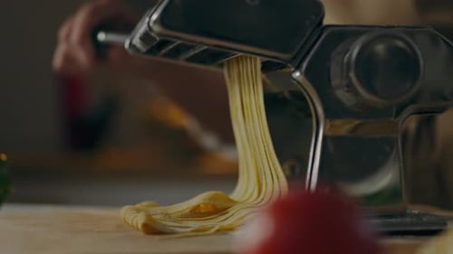 Food, Professional Chef Cooks Spaghetti By Hand On A Roller Machine Spins Rollers In An Authentic
