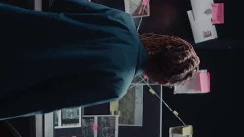 Woman Working At An Evidence Board In Office