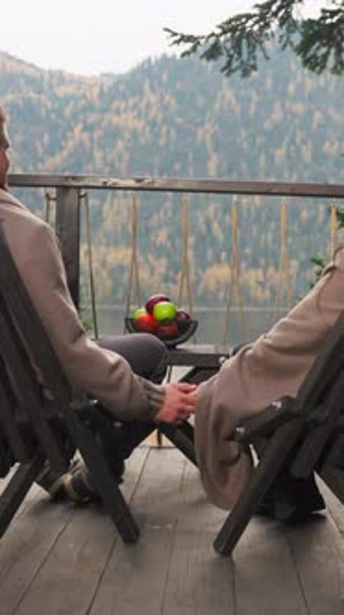 Romantic Couple Holding Hands with Mountain View